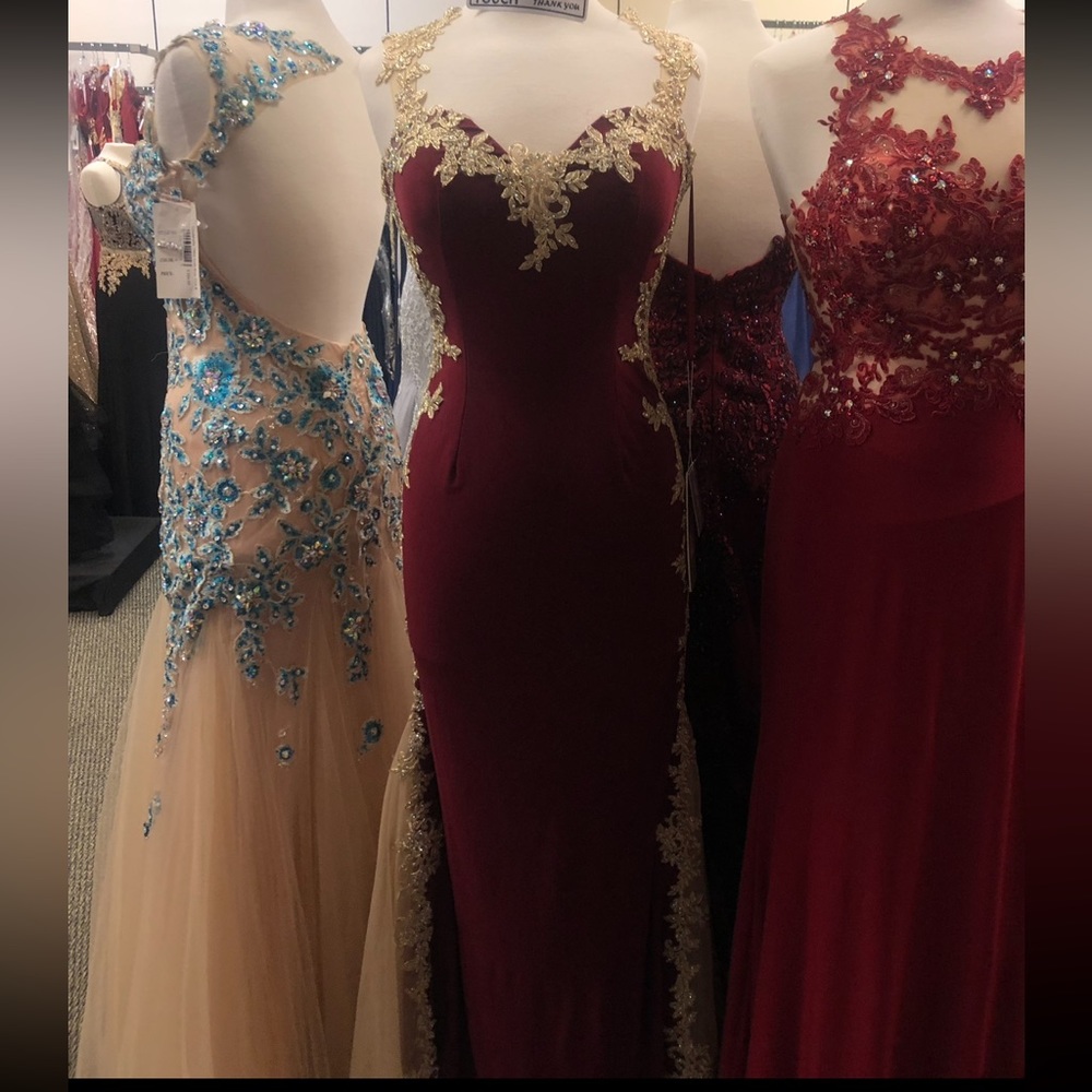 Let’s brand prom dress. Maroon with gold detailing on the side & on back. Size L